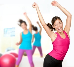 Fitness dance zumba class aerobics. Women dancing happy energetic in gym fitness class.